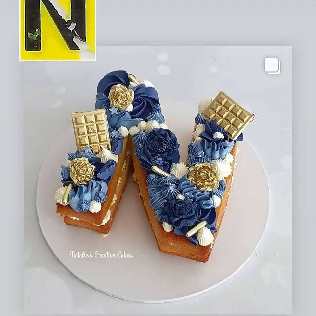 Tiffin letter N cake by @natalies.creative.cakes